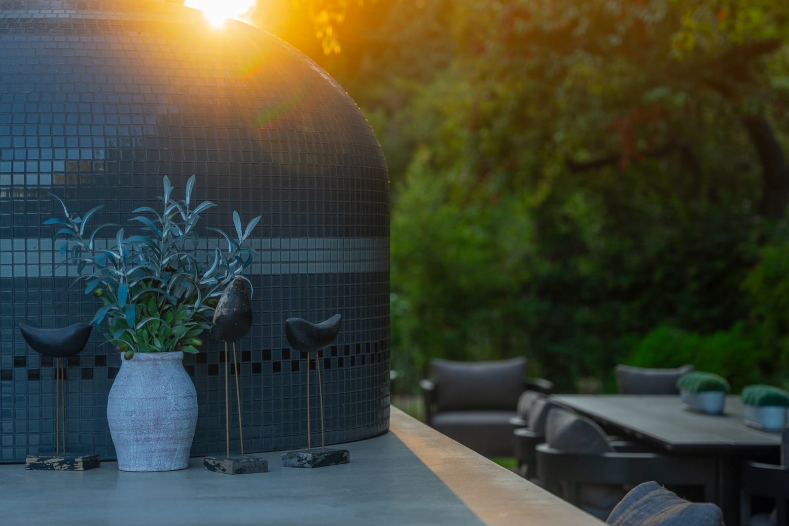 Spanish Estate pizza oven and dining area at sunset