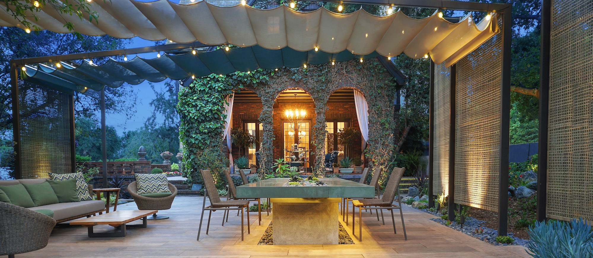 Pasadena outdoor dining patio with pergola, lighting, and mature landscaping