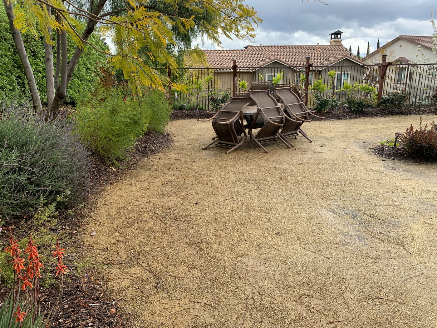 Stacked loungers on bare ground where the pool terrace would later be built