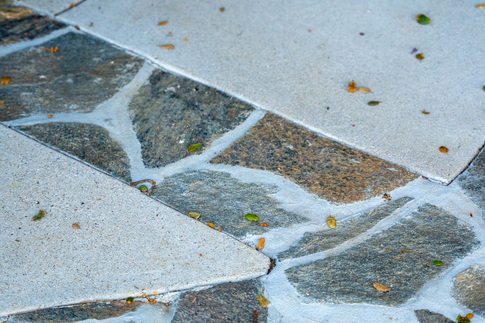 Detail of flagstone banding set into the concrete paving