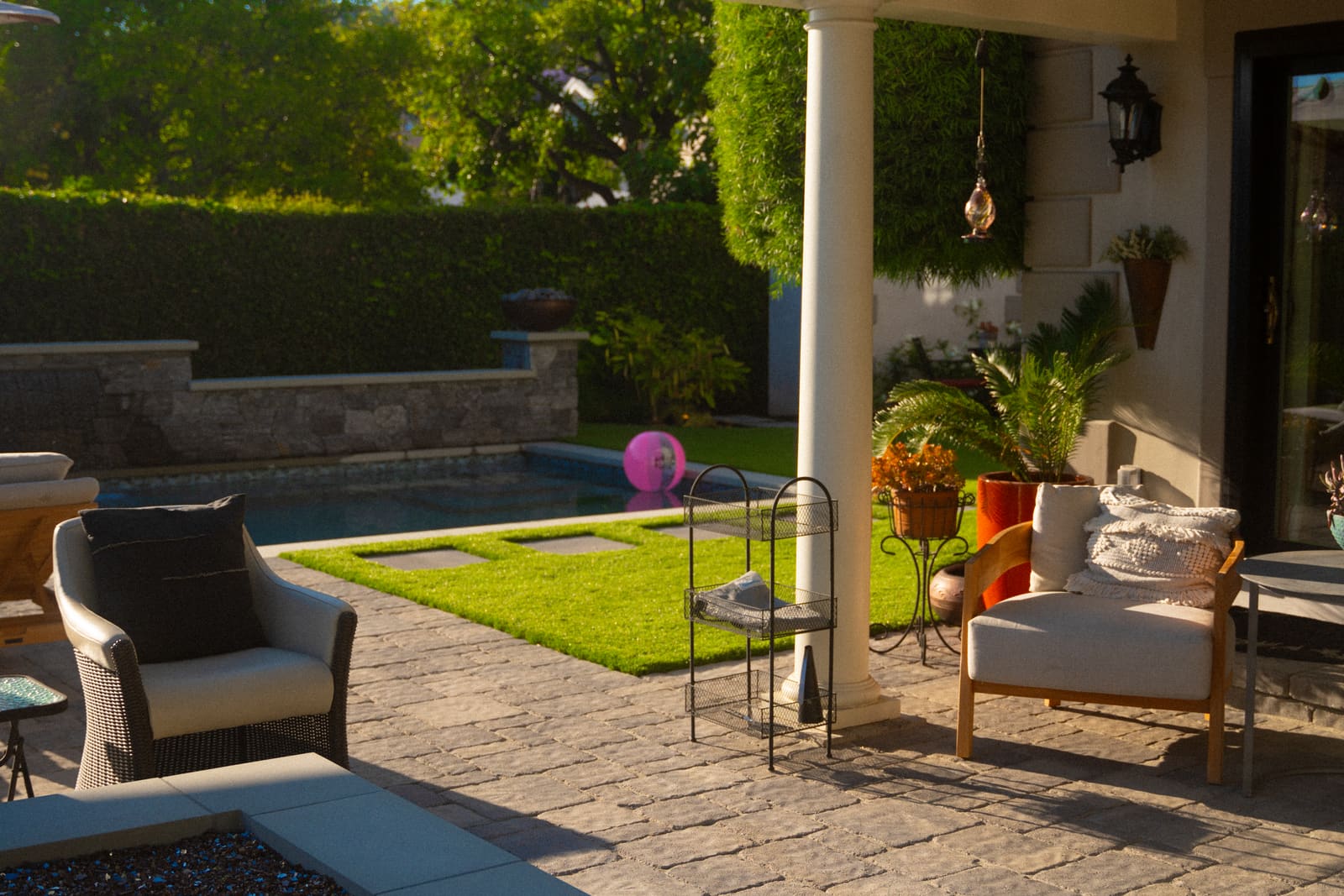 A rectangular pool on axis with the house, framed by lawn and mature planting