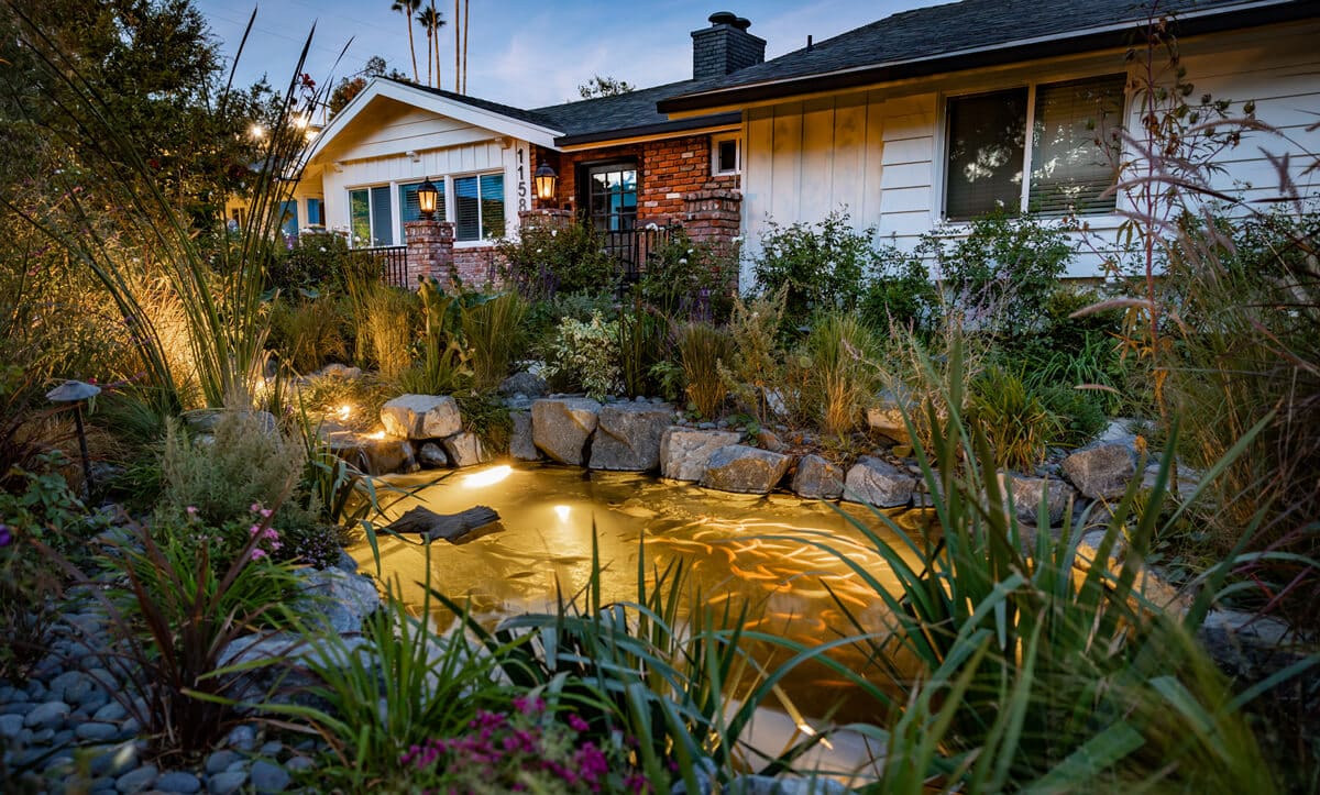 Three small to medium ponds arranged across a front yard landscape