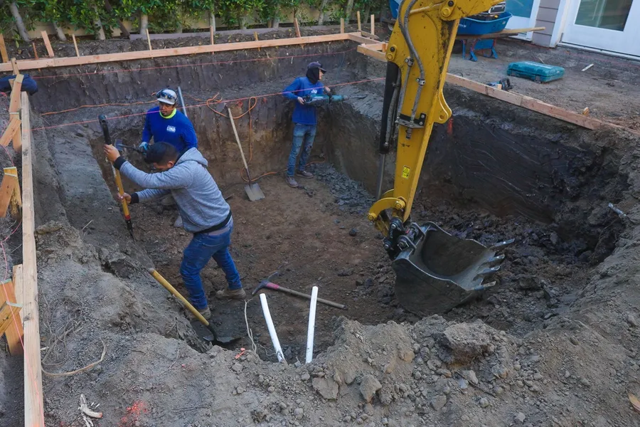 Pacific Outdoor Living crew excavating and forming a pool shell on a Southern California job site