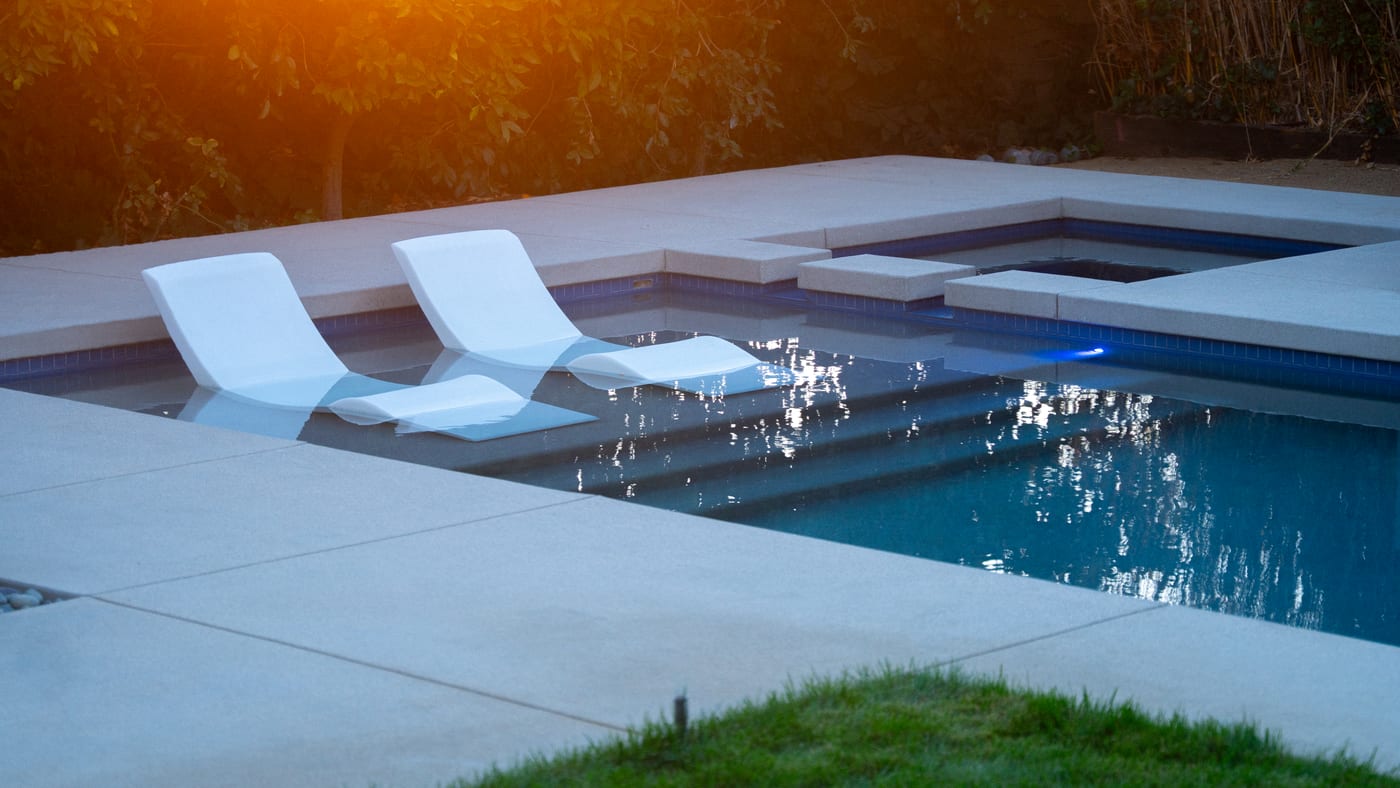A modern outdoor living space with clean-lined hardscape and contemporary planting