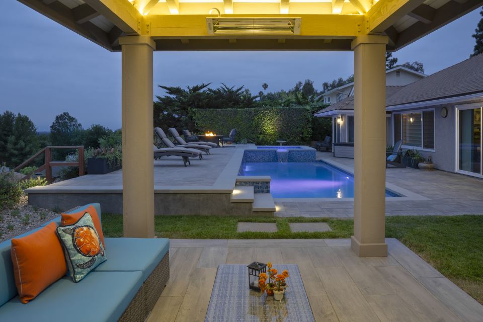 Beverly Hills overlooking a larger pool with patio and patio furniture.