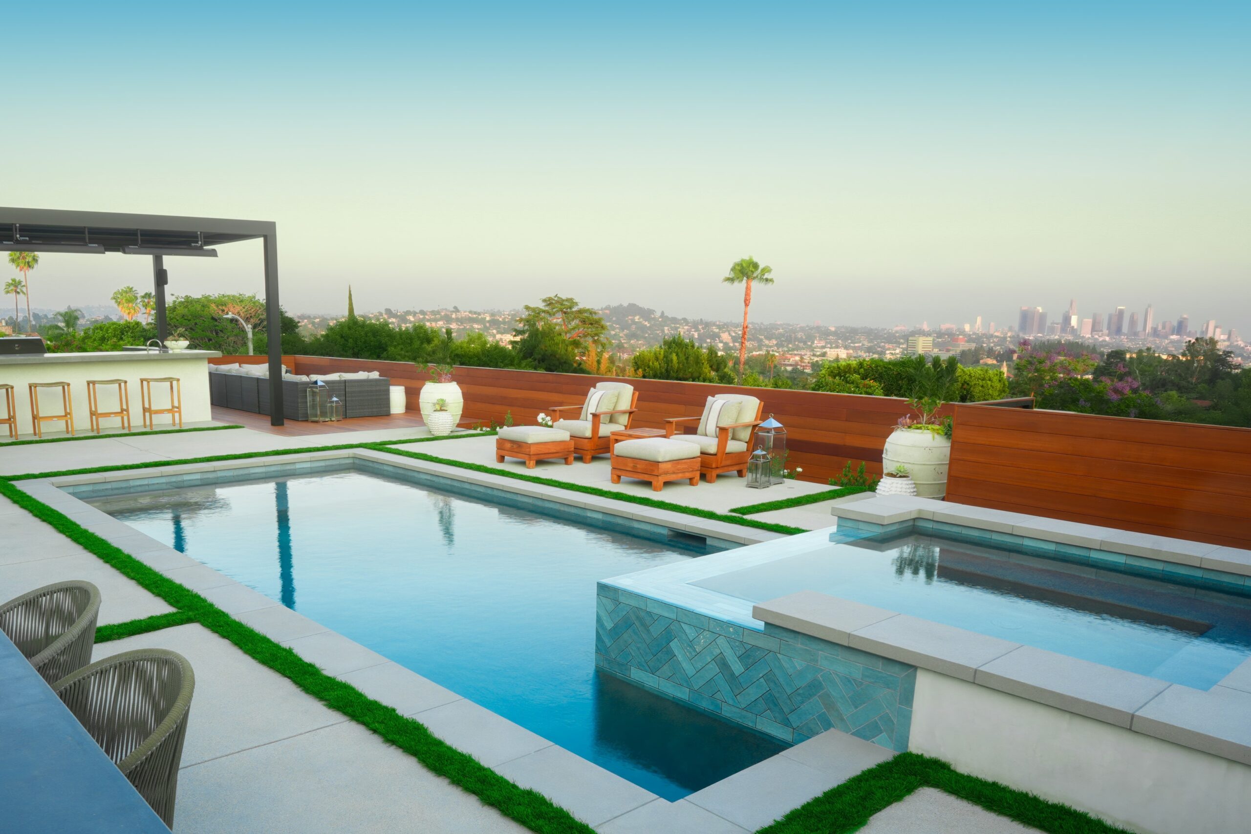 Completed backyard with pool and seating area in Southern California designed and built by Pacific Outdoor Living