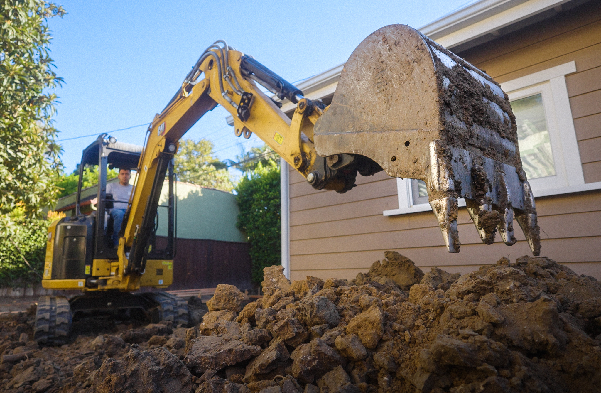 Excavation and grading crew preparing a large property for construction