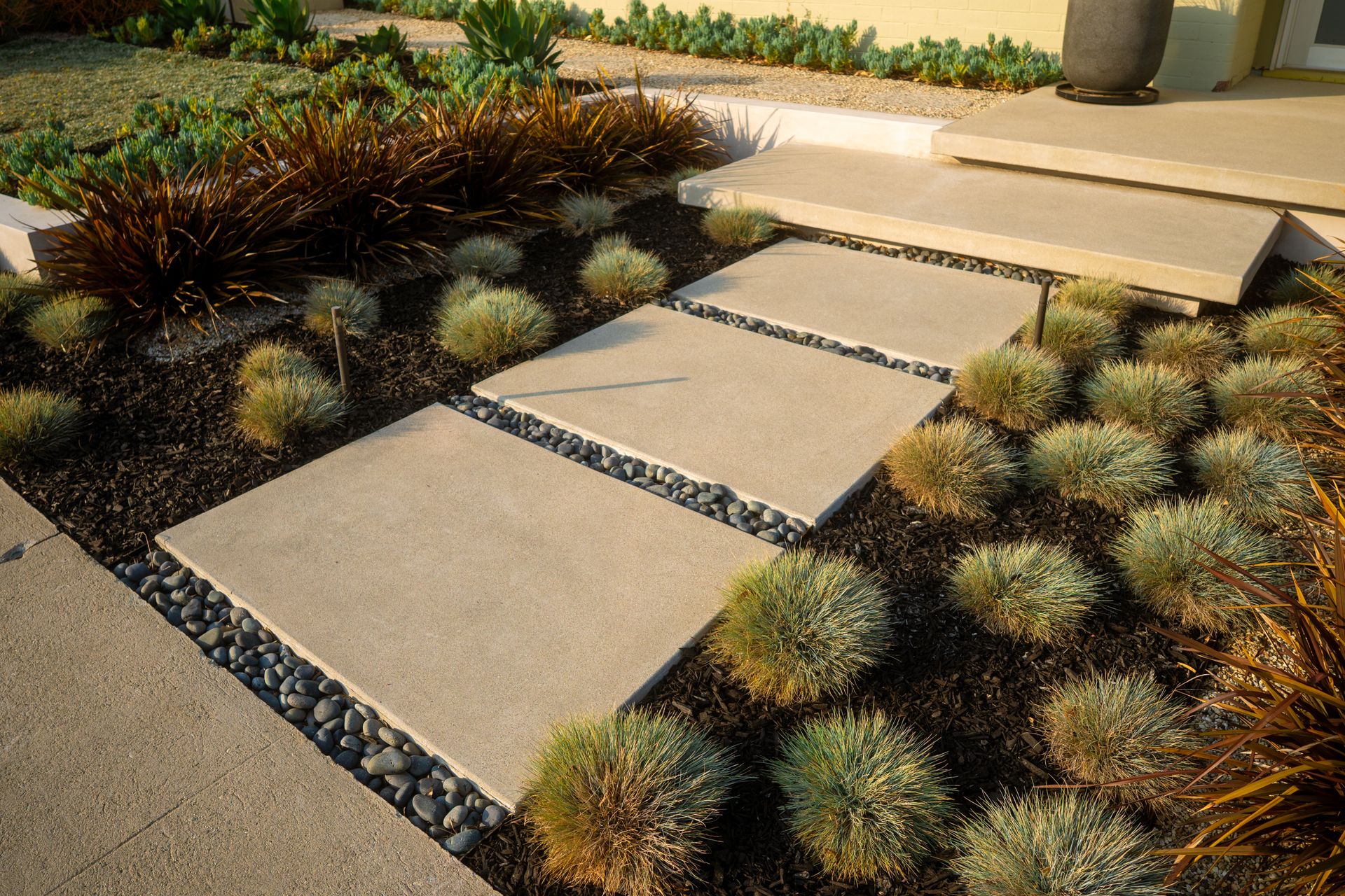 Modern landscape design with drought-tolerant planting and hardscape