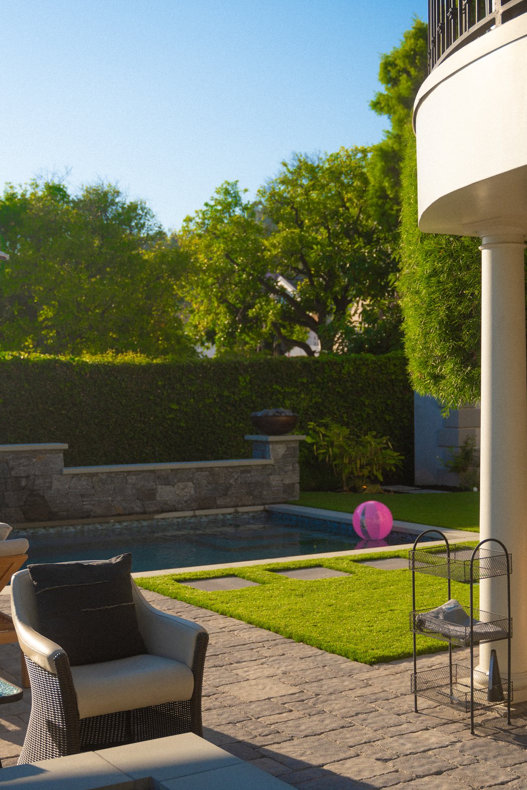 Privacy hedge screening a backyard pool area