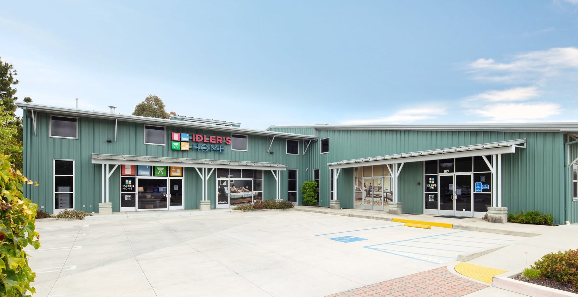 Idler's Home storefront in San Luis Obispo, a green metal-sided building with red and blue Idler's Home signage