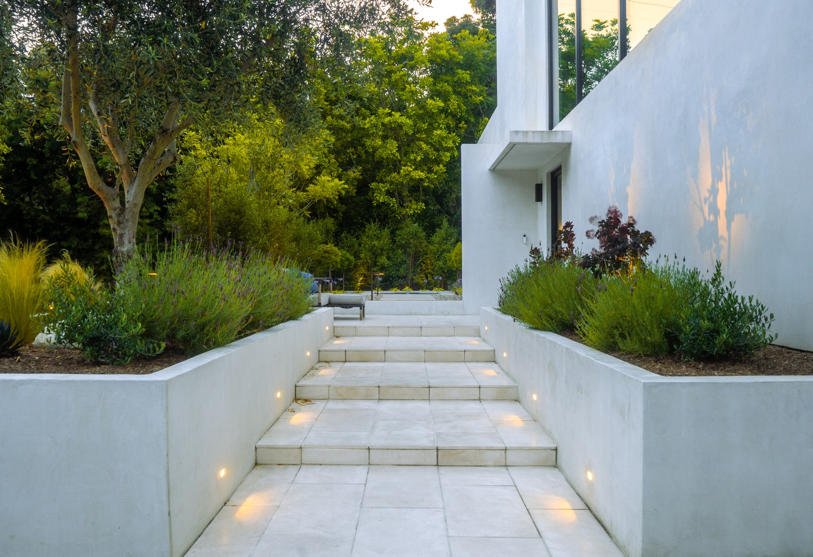 Patio dining area flowing to pool lounging spaces