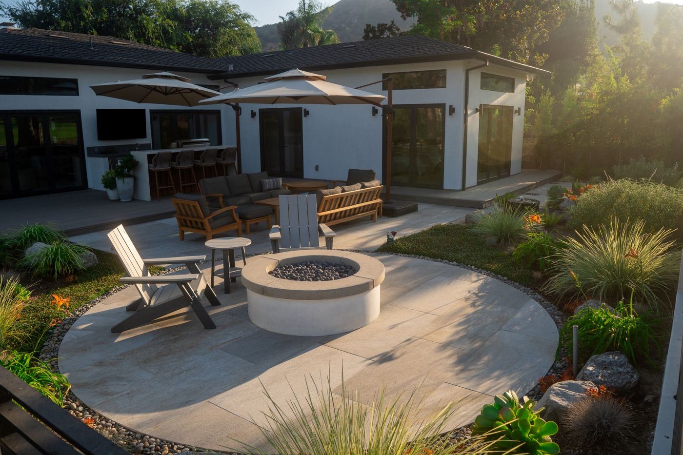Grover Beach coastal native garden with strategic windbreak plantings and sheltered patio area