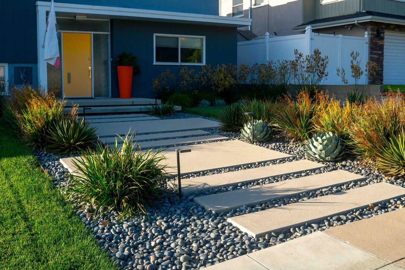 Modern front yard walkway with drought-tolerant planting and concrete steps