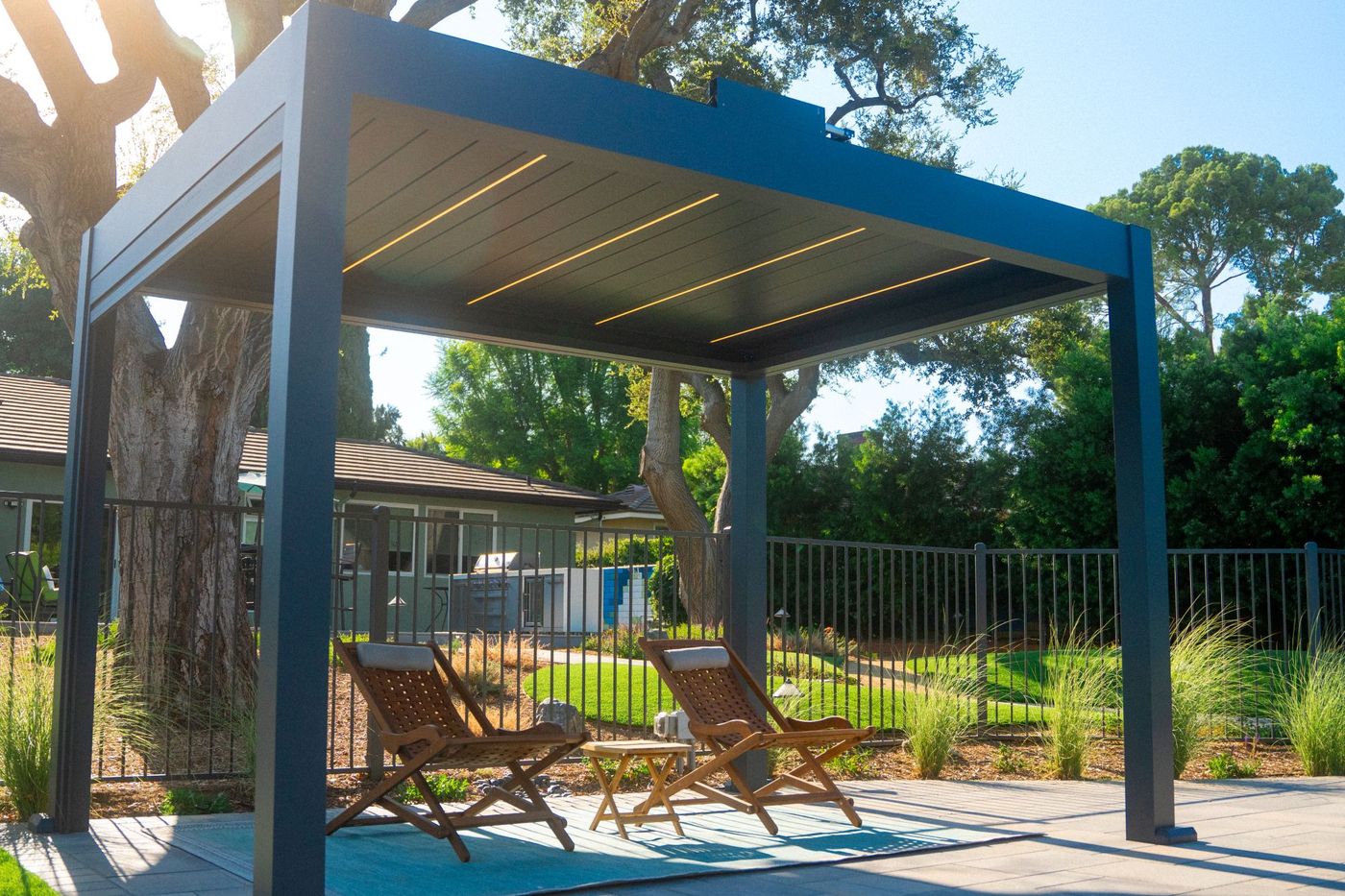 Modern pergola and outdoor lounge in a backyard design