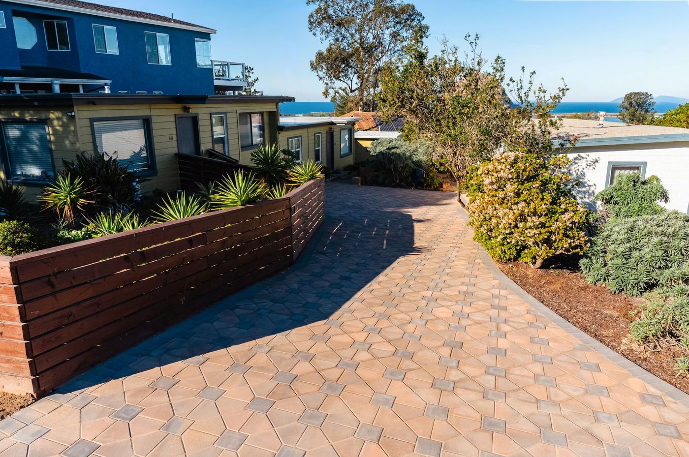 Coastal paver driveway showing siting awareness and material selection