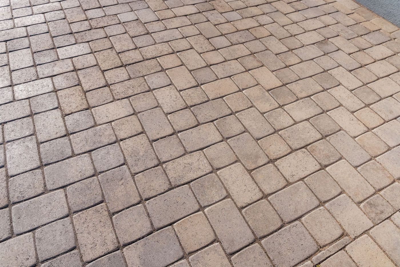 Close-up view of interlocking concrete pavers installed in a custom driveway in Morro Bay, California.