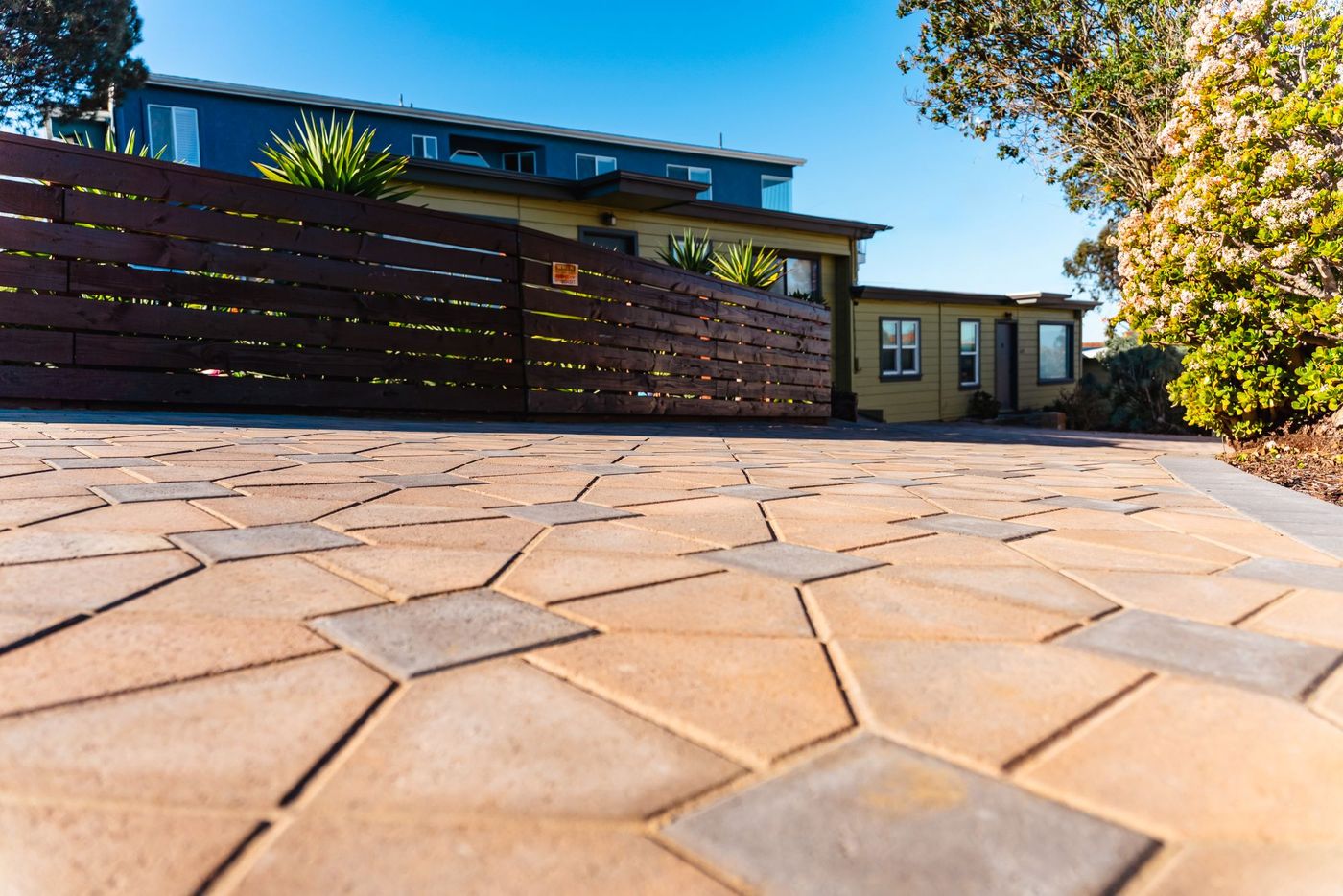 Angled view of interlocking concrete paver driveway installed in Morro Bay, California.