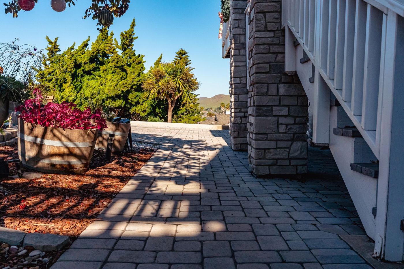 Interlocking concrete paver walkway connecting to a custom driveway installation in Morro Bay, California.