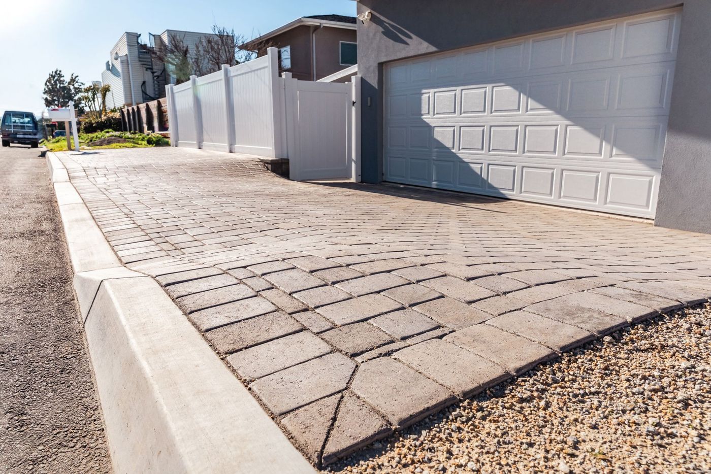 Wide street view of a custom paver driveway installation enhancing curb appeal in Morro Bay, California.
