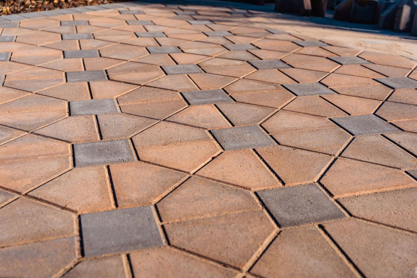 Residential driveway installation in Morro Bay featuring interlocking pavers leading to a modern coastal home entrance.