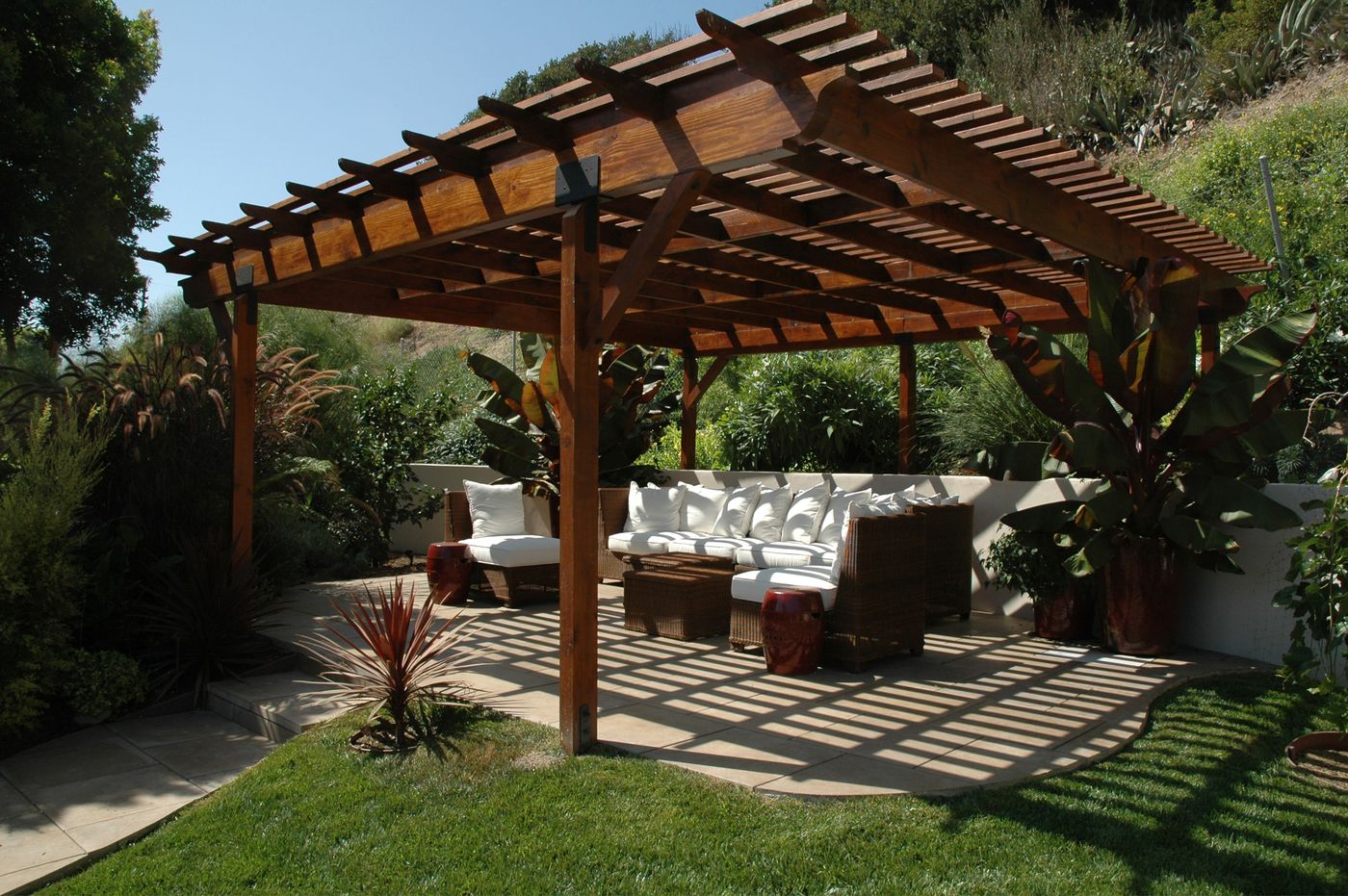 Pergola shade structure over an outdoor seating area