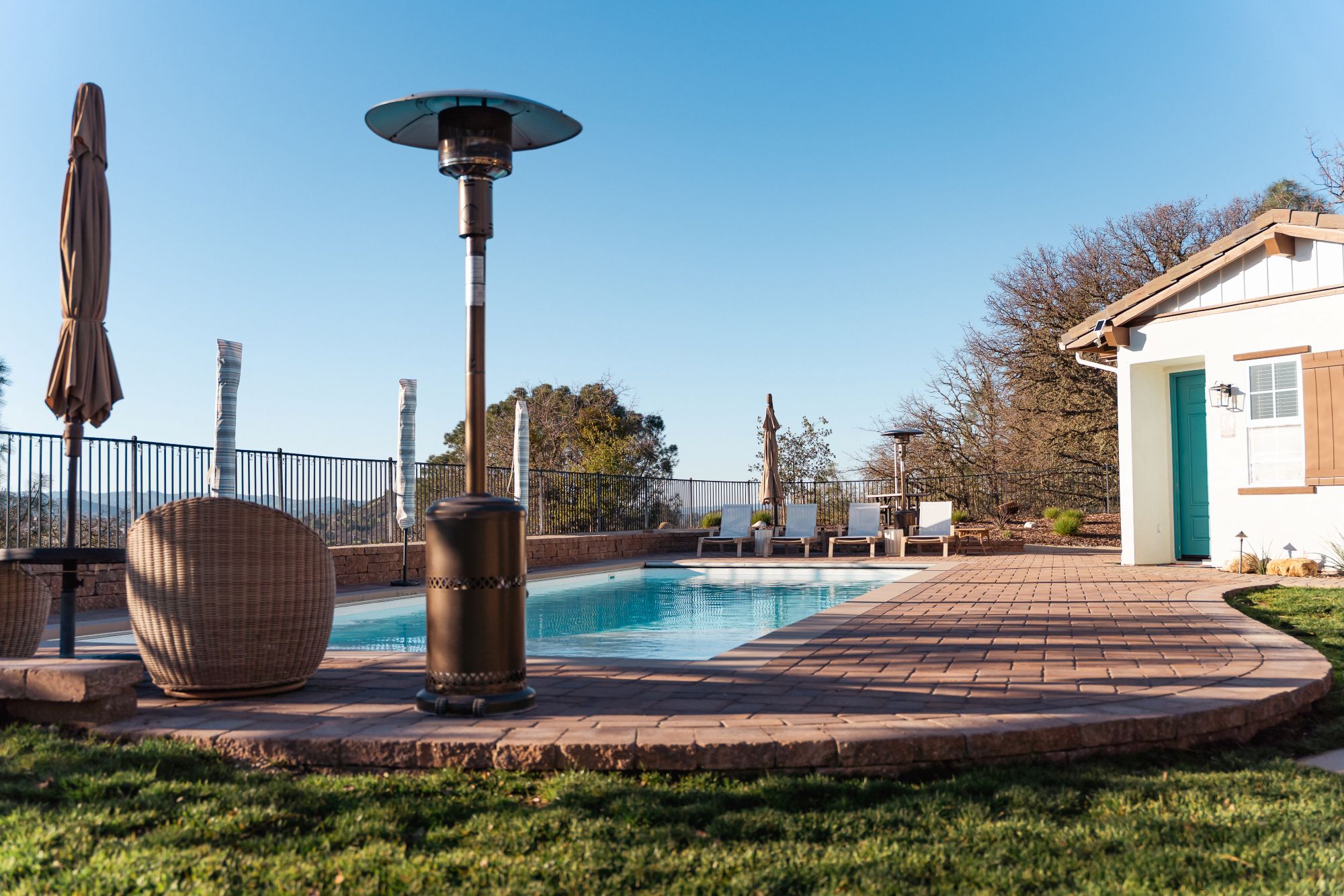 Central Coast backyard pool remodel with paver patio