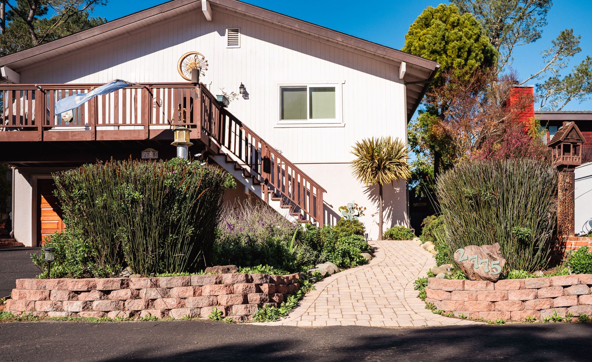 Front entry paver walkway with a retaining wall