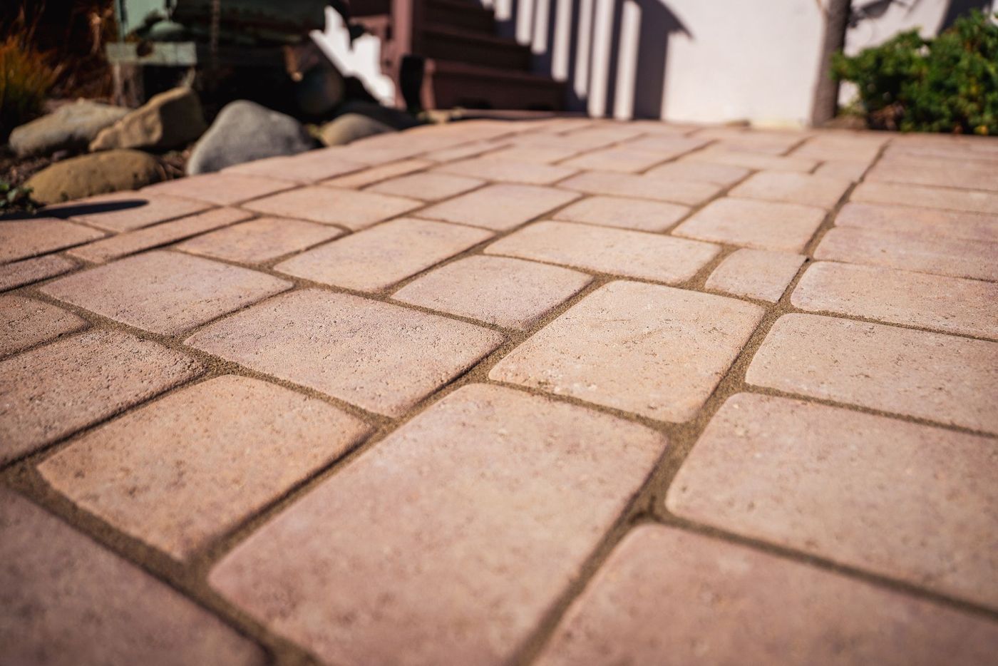 Detailed view of interlocking concrete paver pattern used in a San Luis Obispo front yard walkway installation.