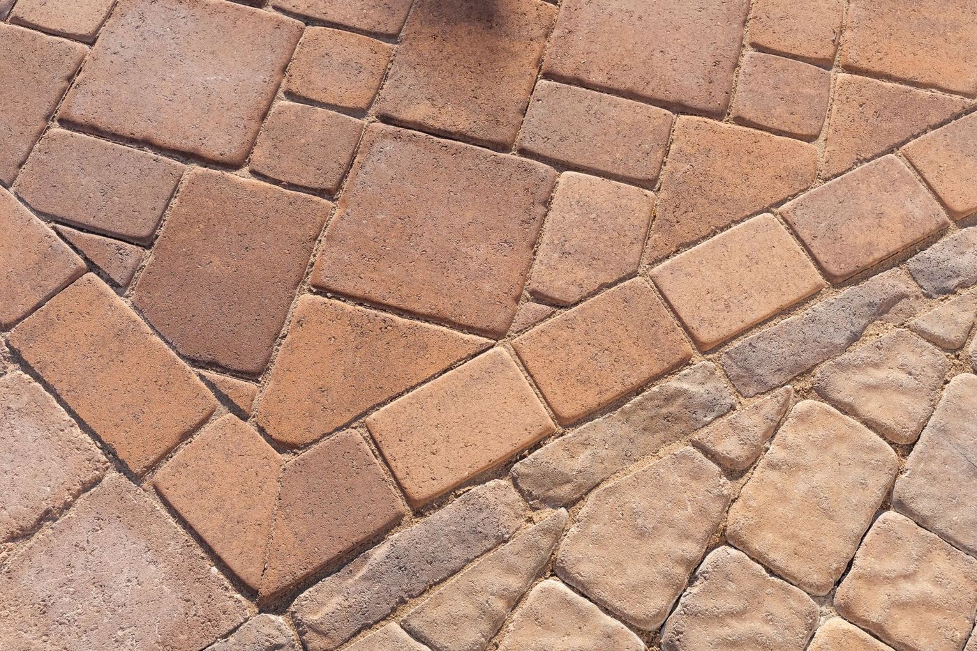 Detailed view of interlocking paver pool deck pattern installed during a San Luis Obispo pool transformation project.