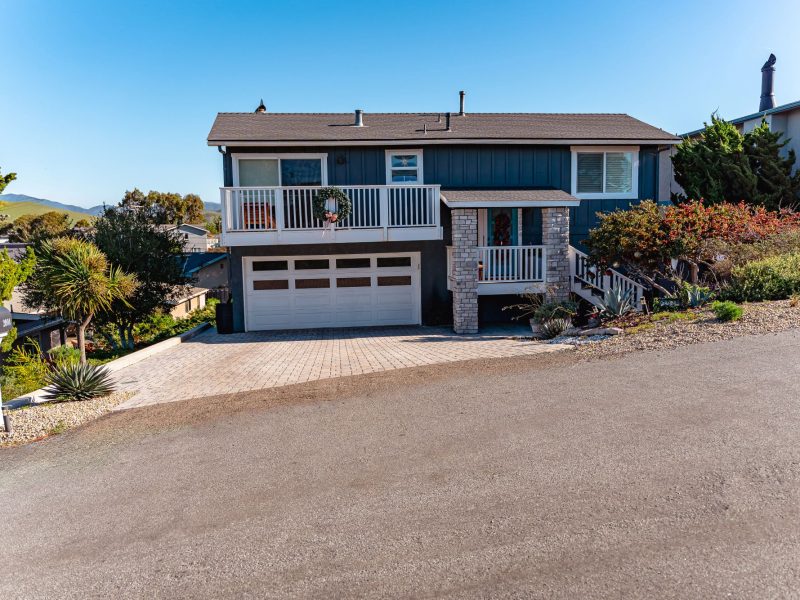 Wide street-level view of custom interlocking paver driveway installation in Morro Bay, California.