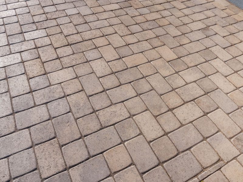 Close-up view of interlocking concrete pavers installed in a custom driveway in Morro Bay, California.
