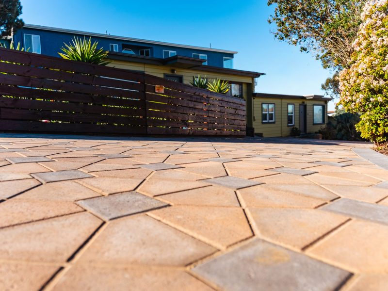 Angled view of interlocking concrete paver driveway installed in Morro Bay, California.