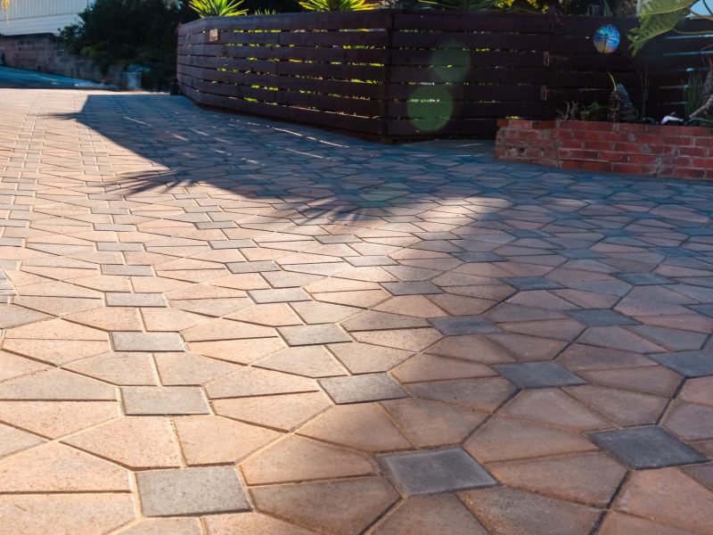 Close-up of interlocking concrete paver pattern used in a custom driveway installation in Morro Bay, California.