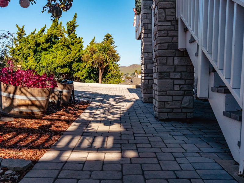 Interlocking concrete paver walkway connecting to a custom driveway installation in Morro Bay, California.