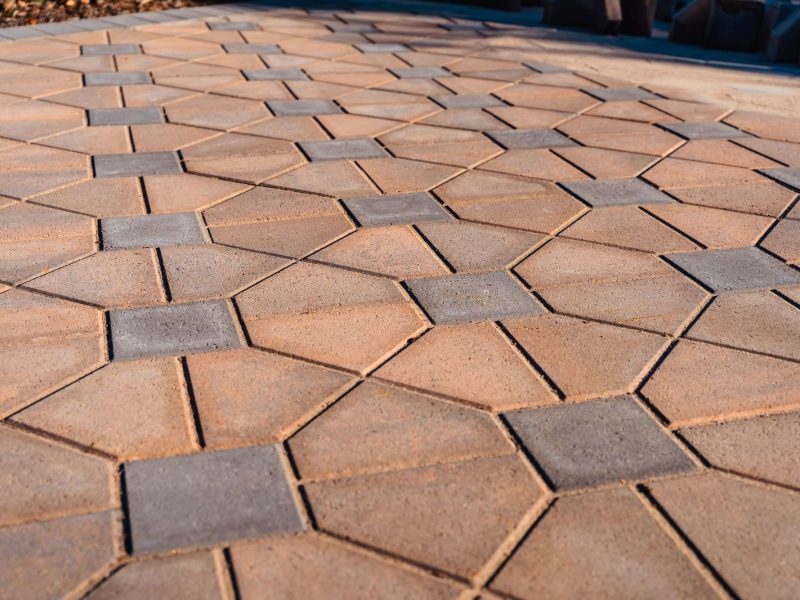 Residential driveway installation in Morro Bay featuring interlocking pavers leading to a modern coastal home entrance.