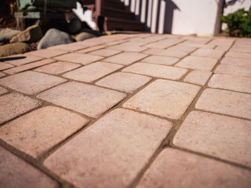 Detailed view of interlocking concrete paver pattern used in a San Luis Obispo front yard walkway installation.